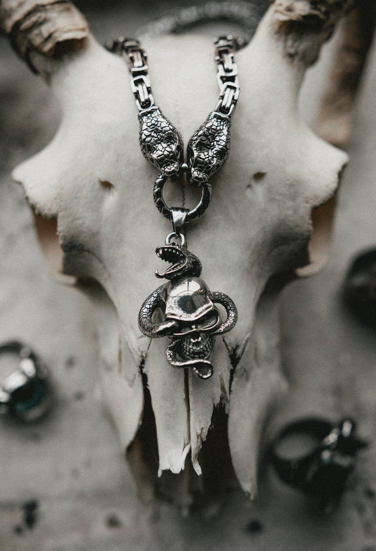 TWIN SERPENTS AND SKULL