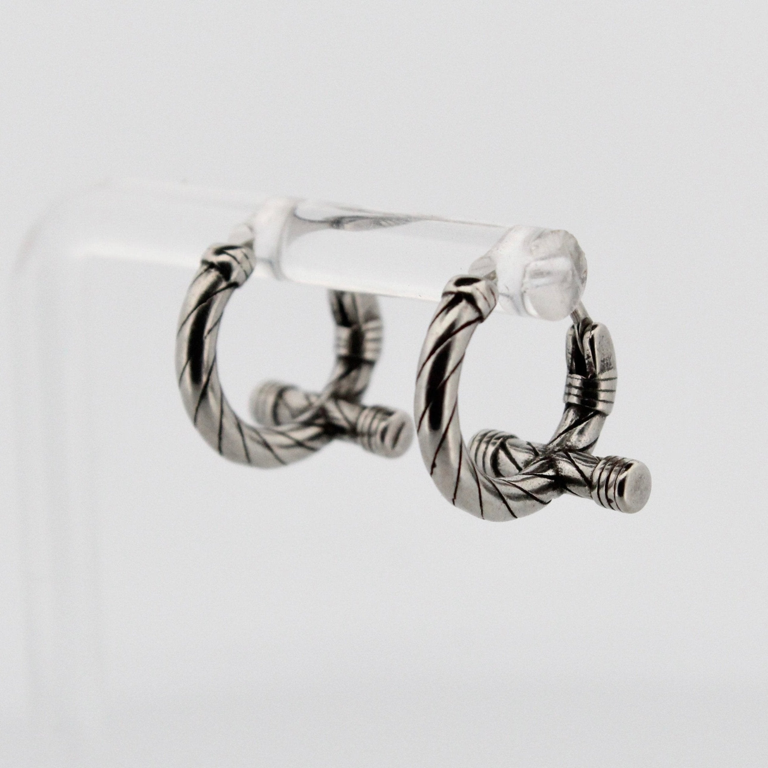 TWISTED CROSS HOOP EARRINGS