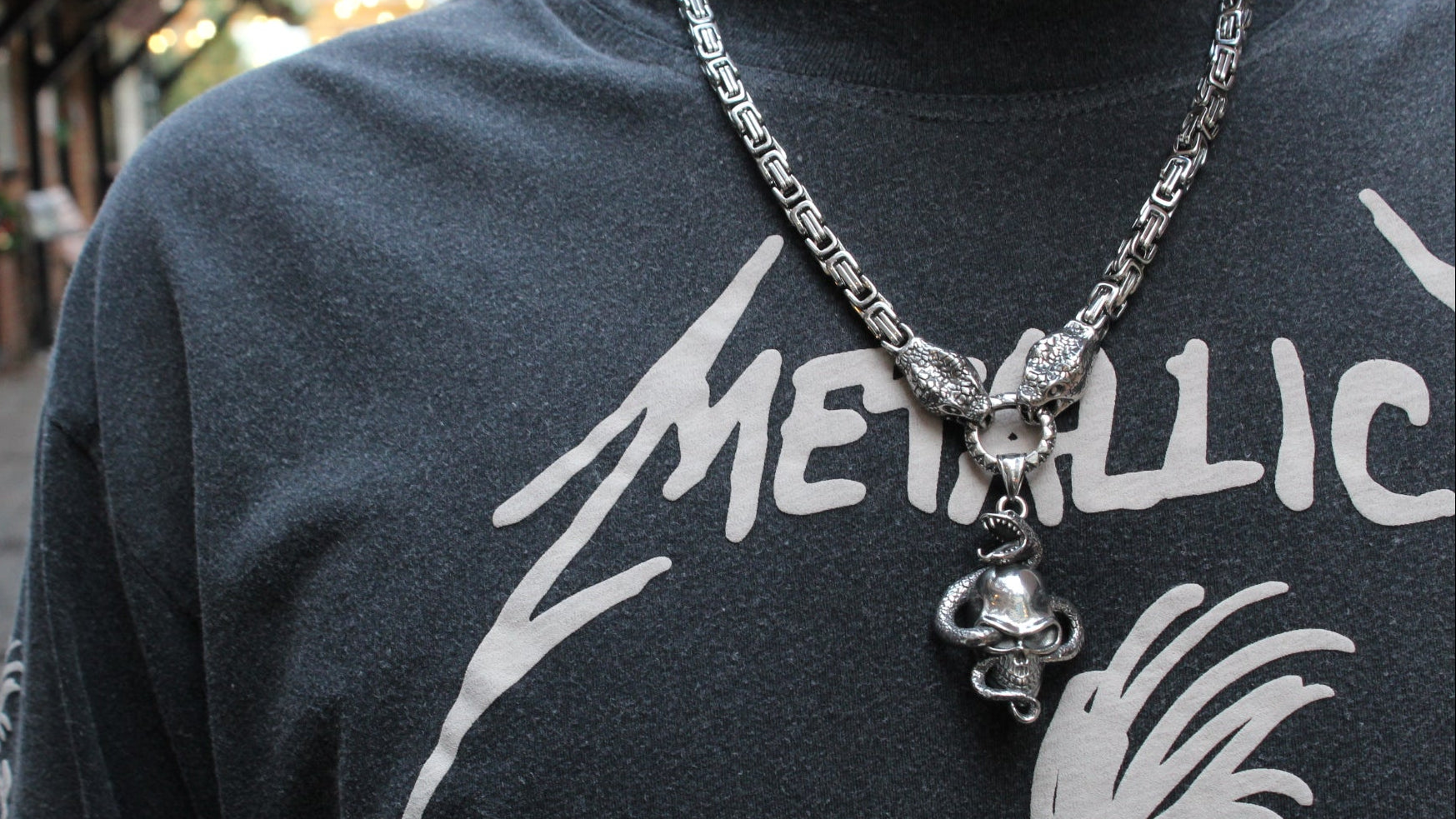 TWIN SERPENTS AND SKULL