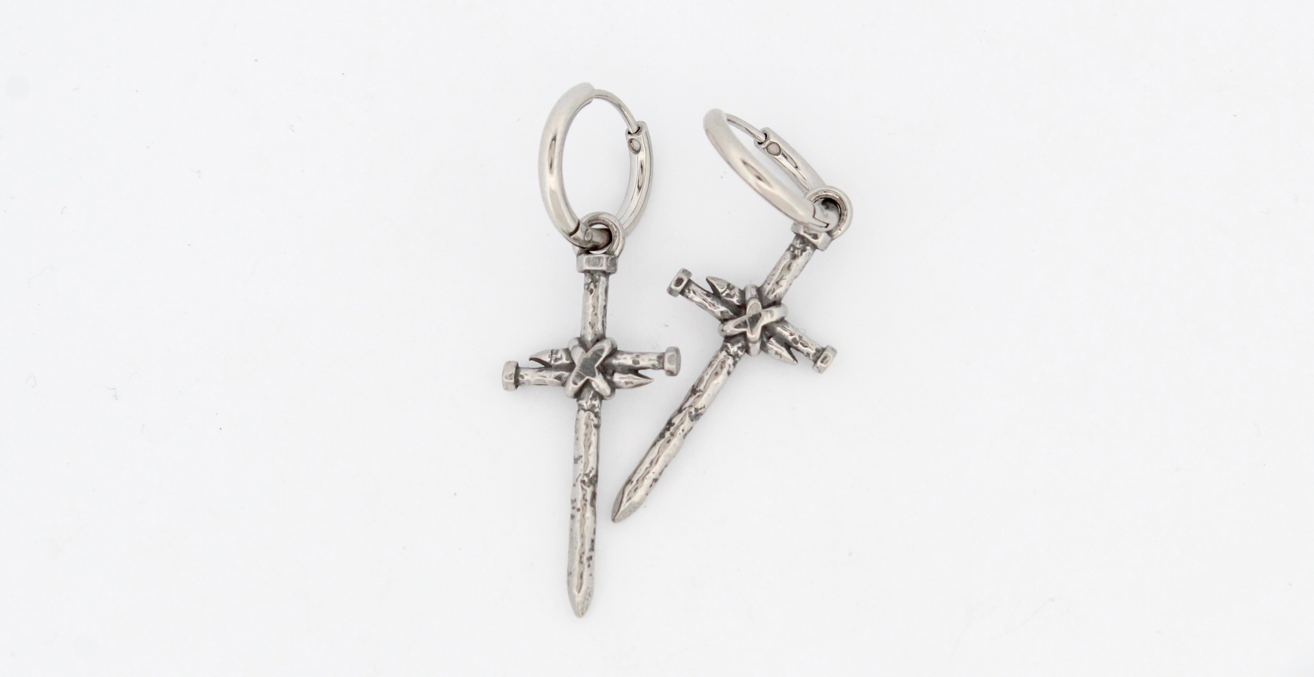 NAILED CROSS HOOP EARRINGS