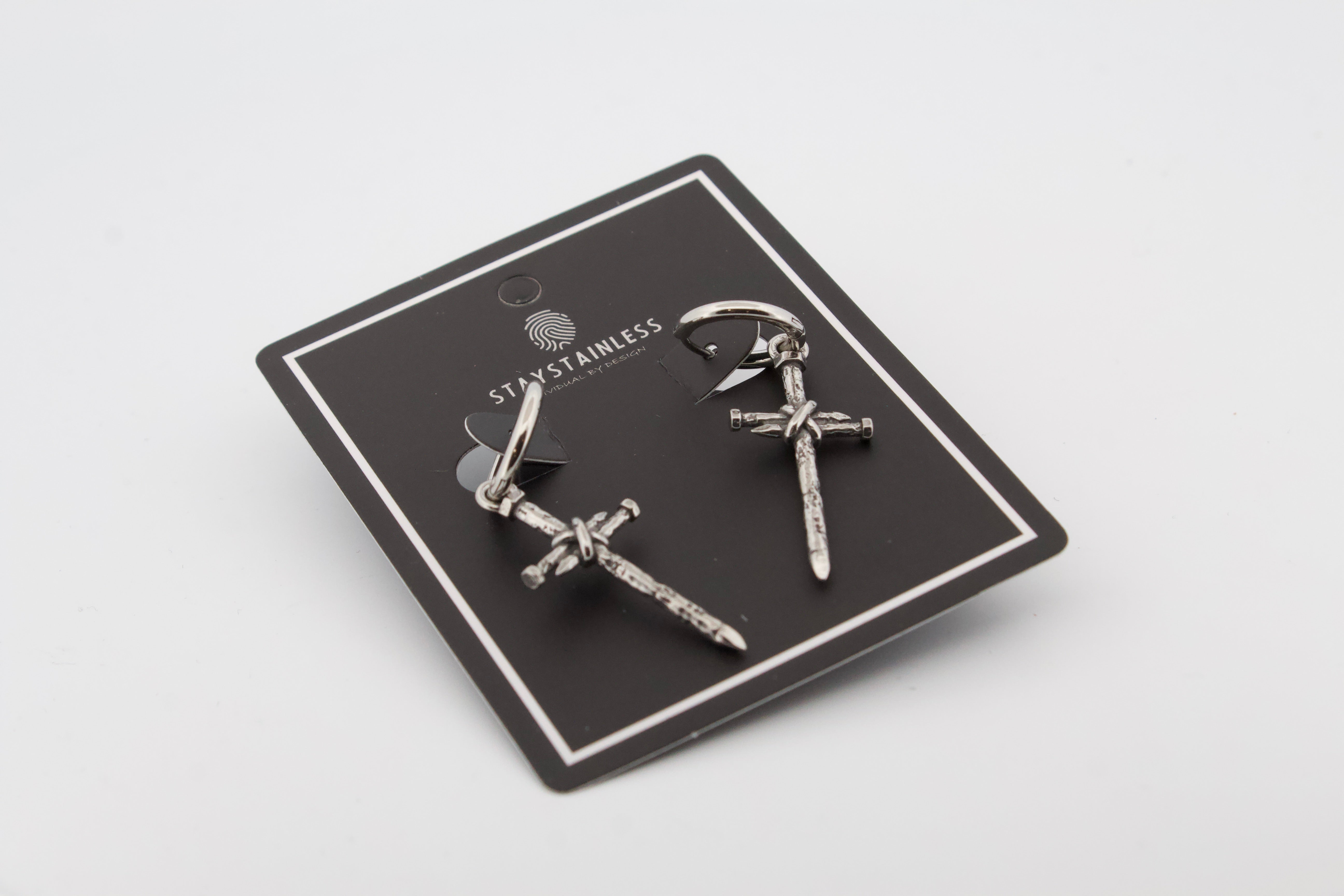 NAILED CROSS HOOP EARRINGS